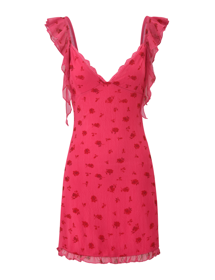 The AMARIS MINI DRESS - DITSY FLORAL by TIGERMIST is a pink V-neck mini dress with ruffled straps, a subtle floral pattern, sheer ruffle accents on the straps and hem, and delicate lace trim for an elegant finish.