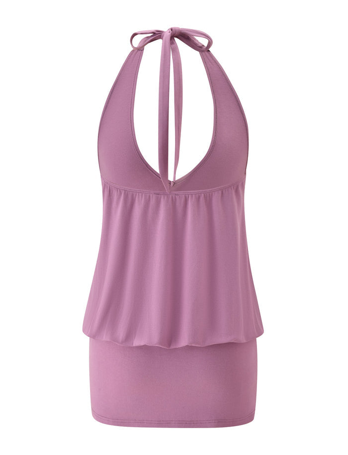 Brand: TIGERMIST Product Name: ANALEE SKORT MINI DRESS - PLUM Rewritten sentence: The ANALEE SKORT MINI DRESS by TIGERMIST features a sleeveless, plum halter neckline tied at the neck, with a deep V-cut, a loose blouson-inspired upper section, and a fitted mini skort silhouette.