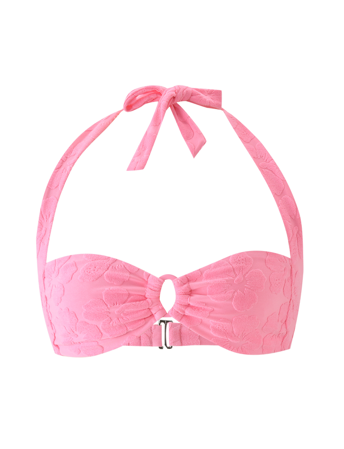 The FIORA BIKINI TOP - BABY PINK by TIGERMIST features textured floral lace, halter straps, a front keyhole cutout, and a metallic clasp detail.