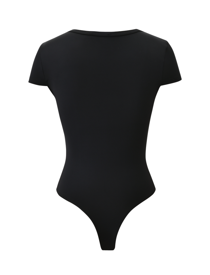 The JAXX BODYSUIT - BLACK by TIGERMIST features short sleeves, a high neckline, and a thong-back design, displayed from the back against a plain white background.