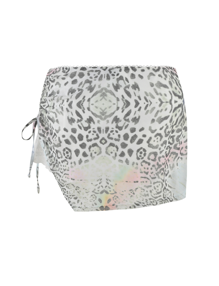 The JOSEPHINE MINI SKIRT by TIGERMIST is a white animal print mesh mini skirt with a symmetrical design, ruched side seams, and a left-side drawstring detail.