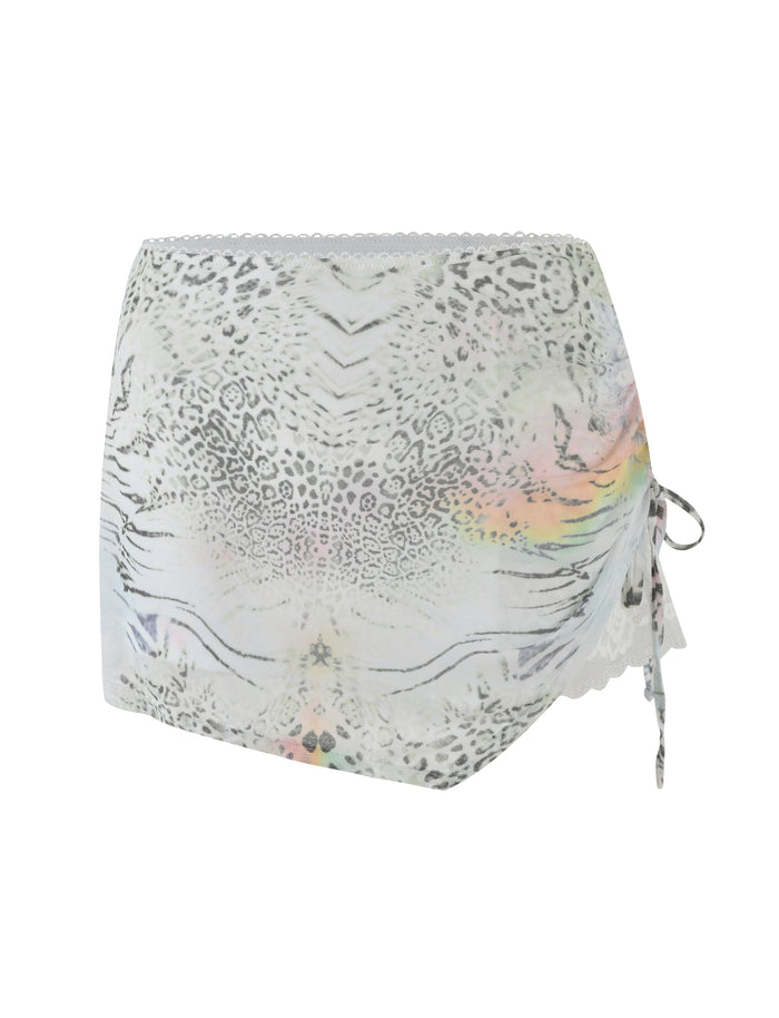 The TIGERMIST JOSEPHINE MINI SKIRT in white features an animal print, pastel accents, lace-trimmed hem, ruched side seams, and a chic side tie detail.