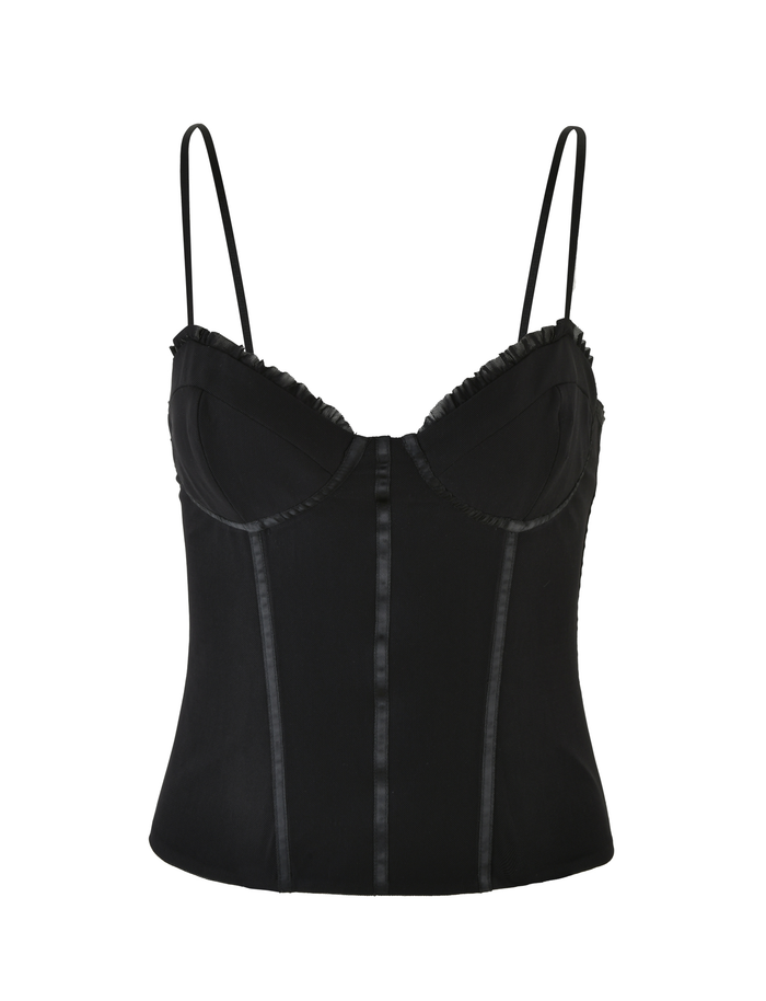 The KAIRA CORSET TOP by TIGERMIST is a black mesh corset with thin adjustable straps, structured cups, vertical seams, and subtle ruffle trim along the neckline, shown against a white background.