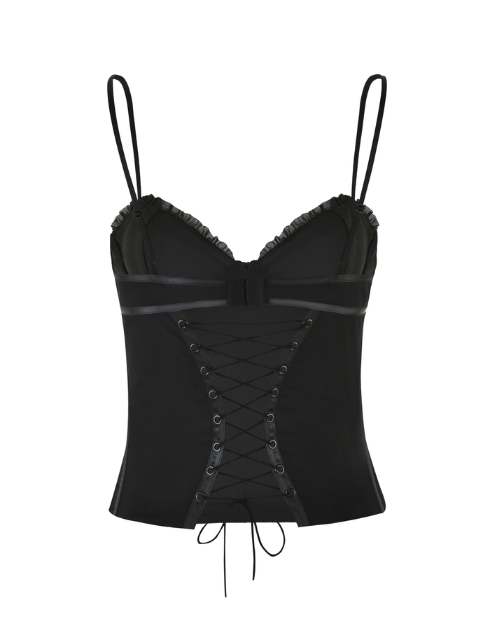 The KAIRA CORSET TOP - BLACK by TIGERMIST is a black mesh corset top with thin adjustable straps, ruffled bust trim, and elegant lace-up eyelet detailing on the front.