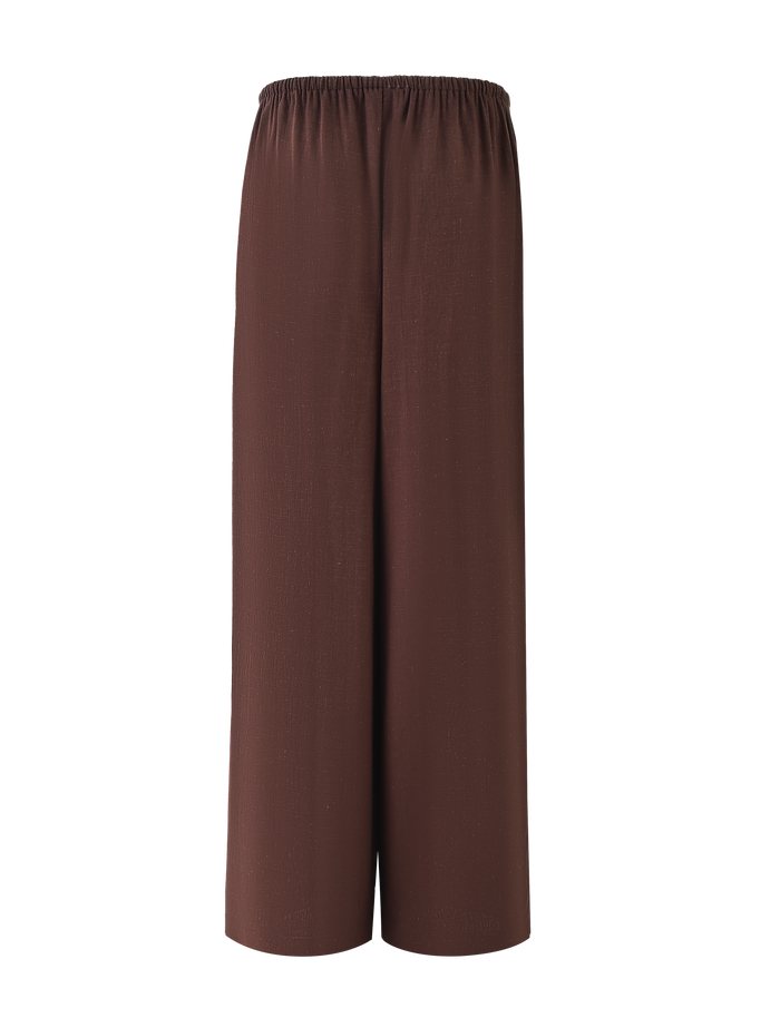 The TIGERMIST LAINEY PANT in Chocolate features a wide-leg, ankle-length design with a mid-rise elastic waist and functional side pockets, shown against a plain background.