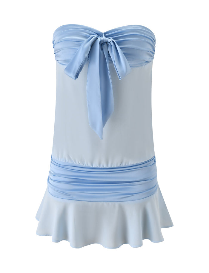 The TIGERMIST LUX MINI DRESS in baby blue features a strapless, ruched bodice, bow tie at the chest, gathered waistband, and flared ruffle hem. Displayed on a plain white background.