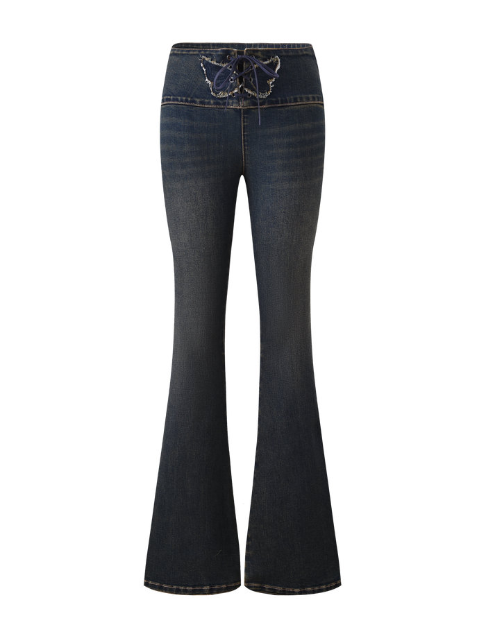 The TIGERMIST RIONA JEAN - MIDWASH features a high waist, flared legs, front lace-up closure, and butterfly embroidery on the waistband, shown against a white background.