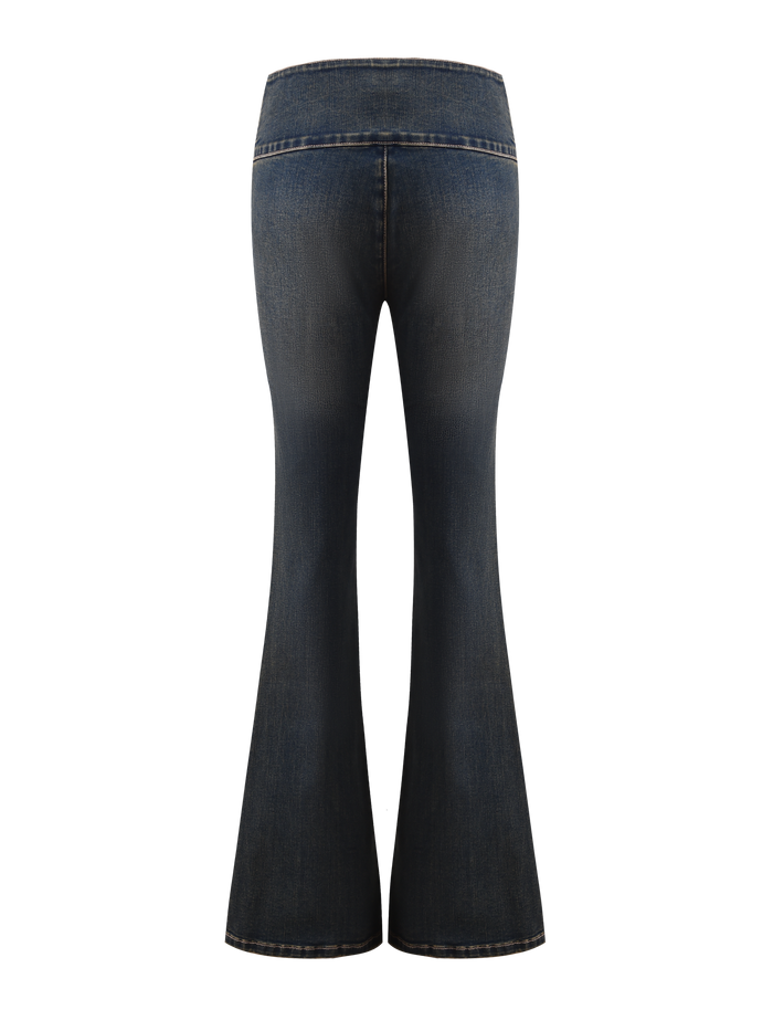 The RIONA JEAN - MIDWASH by TIGERMIST is a high-waisted, flared-leg denim jean in dark blue, shown from the back against a white background.