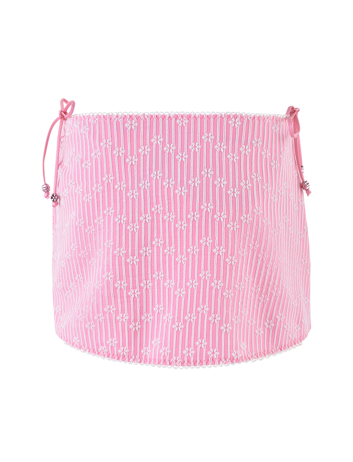 The SAHRA BIKINI 2PC BOTTOM by TIGERMIST features a pink flower stripe pattern with ribbon side ties and a slightly ruffled hem, crafted from textured rib fabric.