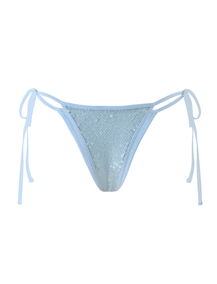 The SOLAS SEQUIN BIKINI BOTTOM - SKY BLUE by TIGERMIST features sequins, adjustable waist ties, and a cheeky fit, shown against a plain white background.