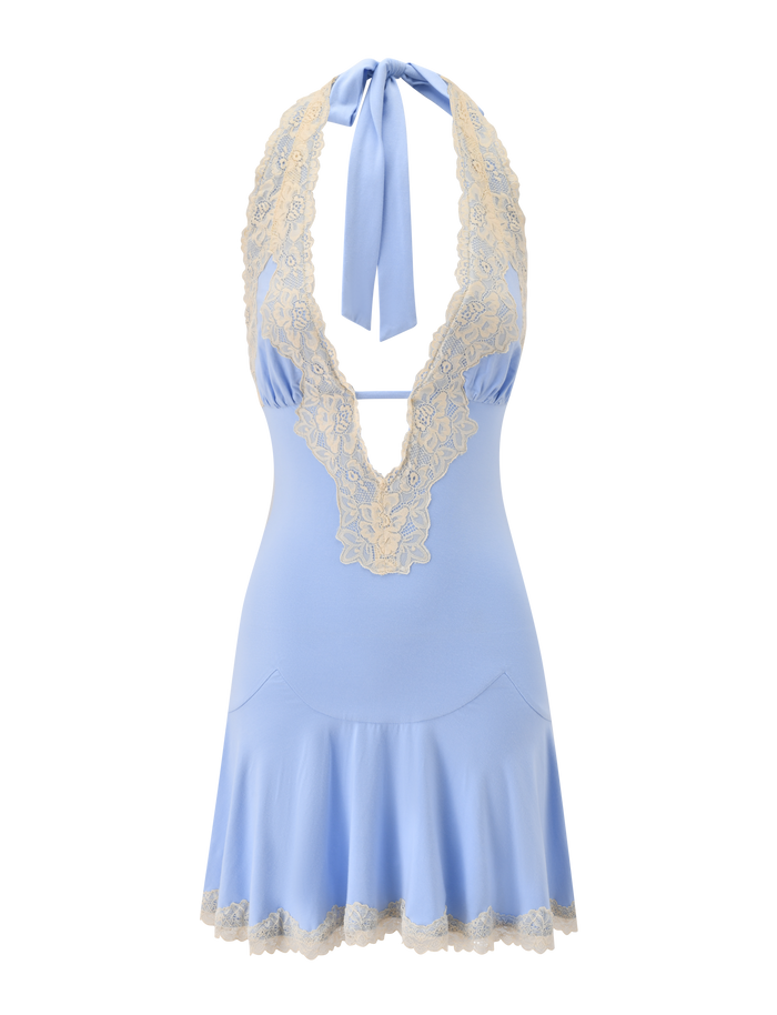The TALIYAH MINI DRESS by TIGERMIST is a cornflower blue halter-neck mini dress adorned with cream lace trim along the neckline, bust, and hem. It features a deep V neckline and ties elegantly at the neck with a wide sash for a refined finish.