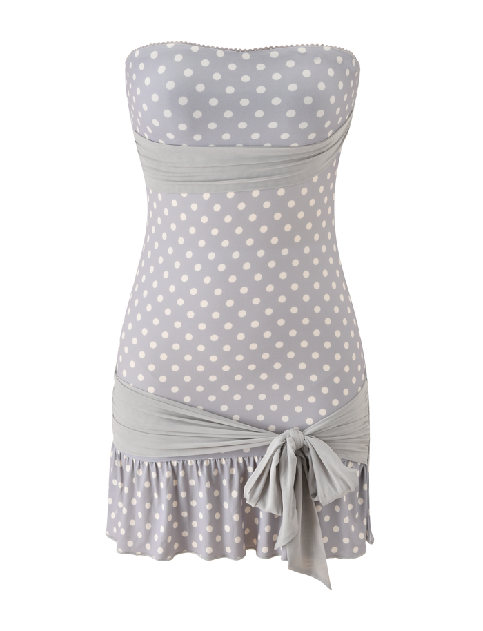 The TOVE MINI DRESS by TIGERMIST features a strapless design in dove grey and cream dot, with a sweetheart neckline, wide waistband, ruffle hem, and a side tie detail at the hip.